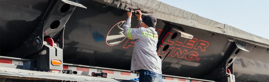 Western Truck & Trailer technician servicing a commercial trailer in the shop