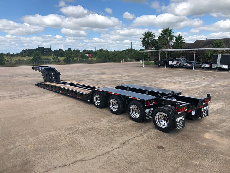 Choice lowboy trailer at work